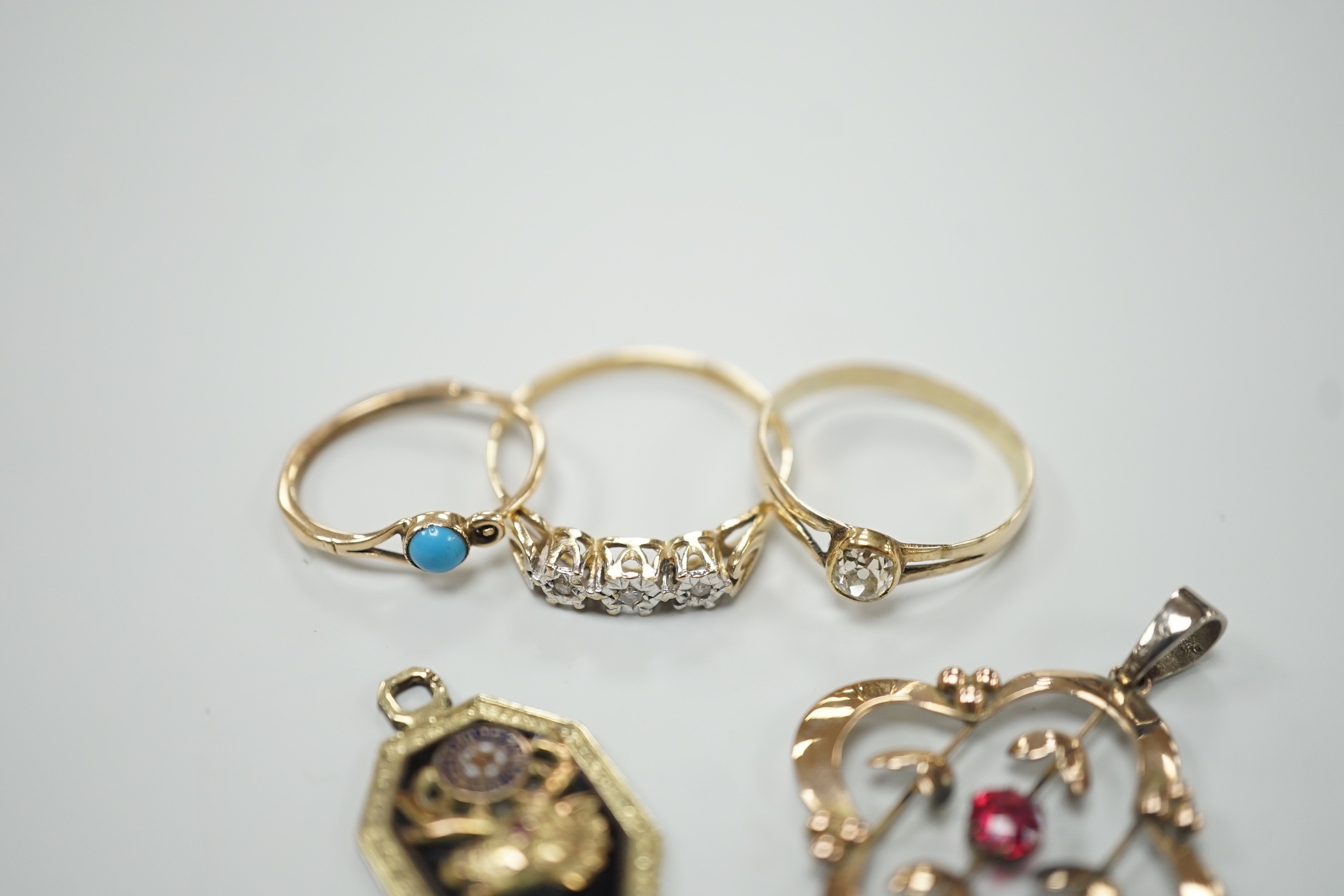 A yellow metal and old mine cut solitaire diamond set ring, size N, gross 1.1 grams, a 9ct gold and three stone diamond chip set ring, a yellow metal and turquoise set earring, an enamelled pendant and a 9ct and gem set